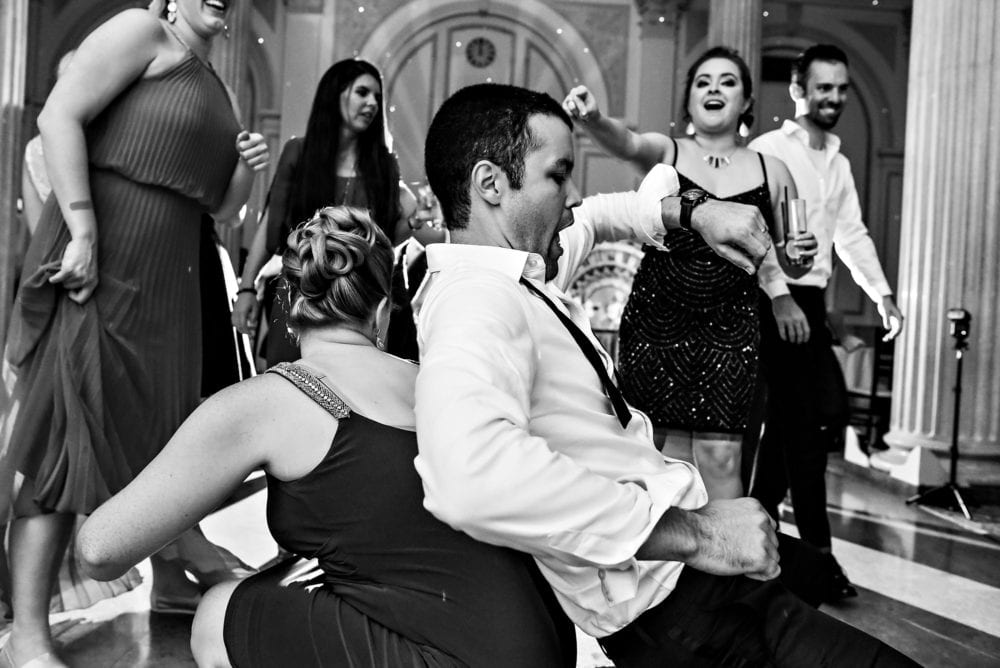 Groom dances at wedding reception