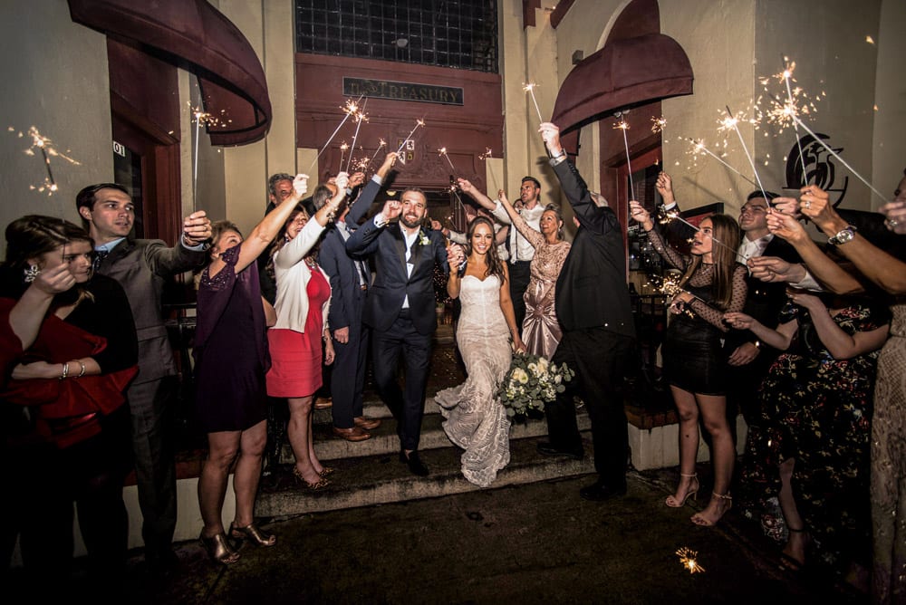 Wedding reception exit at Treasury on the Plaza | An Intimate Wedding in St. Augustine | Mackenzie + Nick