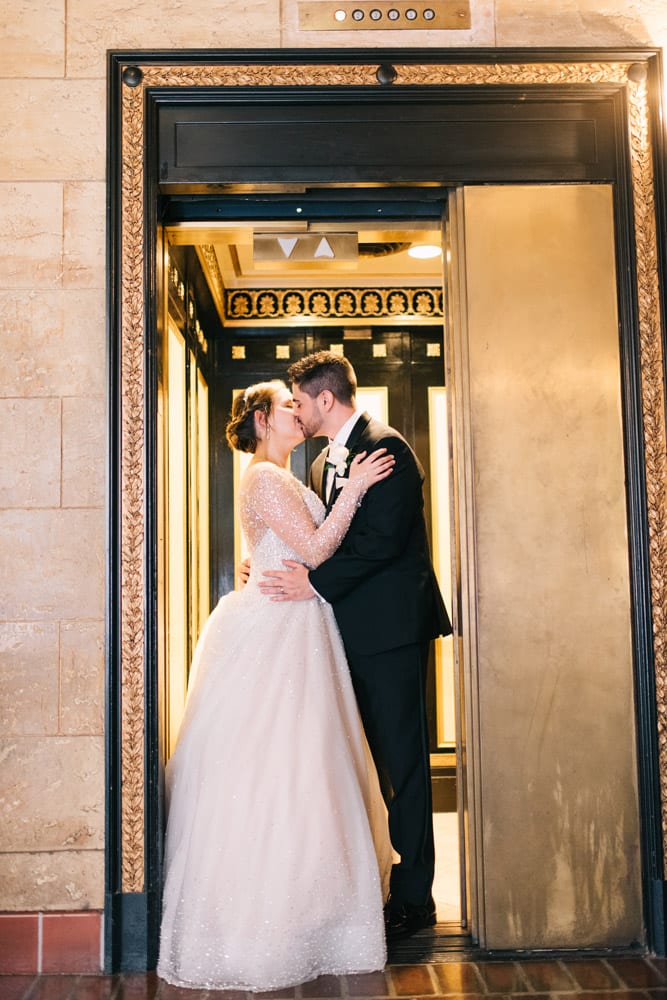 Elevator Wedding Picture | Alex + Michael | High School Sweethearts Tie the Knot at The Treasury on the Plaza 