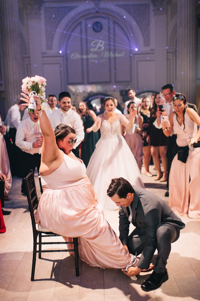 Bouquet toss | AAlex + Michael | High School Sweethearts Tie the Knot at The Treasury on the Plaza