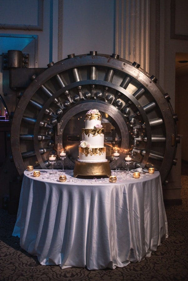 wedding cake set up in front of Treasury On the Plaza's historic bank vault