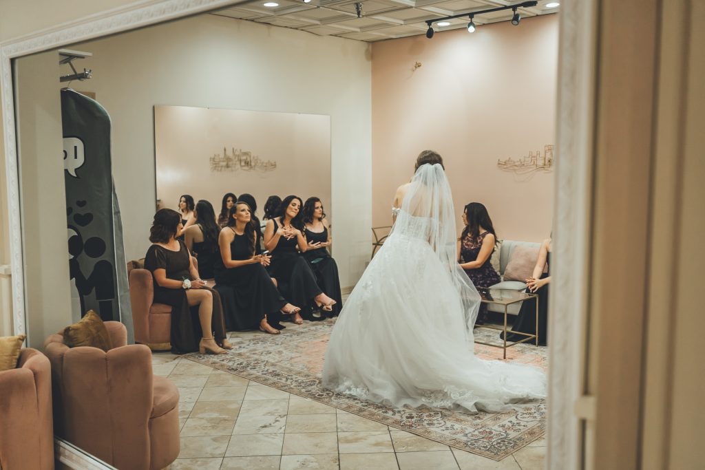 Bride gets ready in pink suite for wedding day