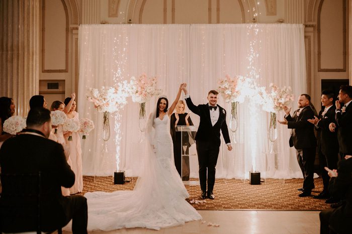 wedding ceremony sparklers | Glam Wedding with a Rock and Roll Surprise at The Treasury | Cristal + Steven