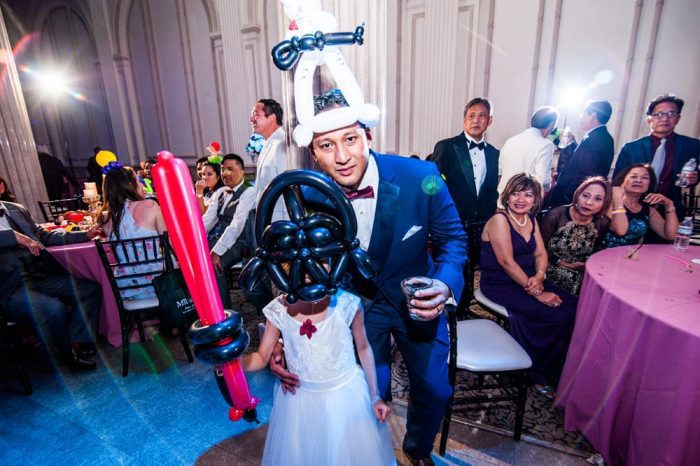 Balloon artist at The Treasury on the Plaza | 7 Ways to Make Your Wedding Reception More Fun