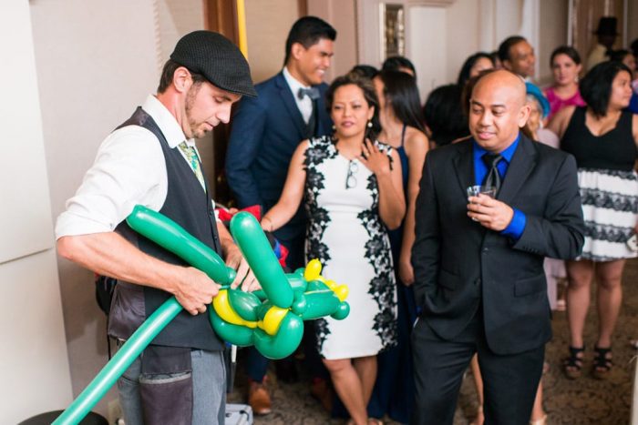 Balloon artist at The Treasury on the Plaza | 7 Ways to Make Your Wedding Reception More Fun