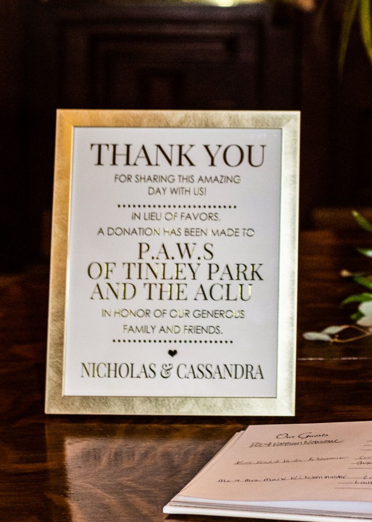 sign indicating a donation was made to a local charity in lieu of flowers