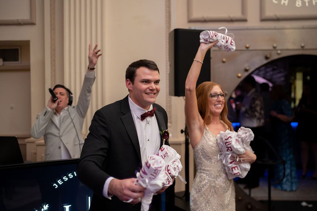 Jessica and Alex passing out t-shirt wedding favors