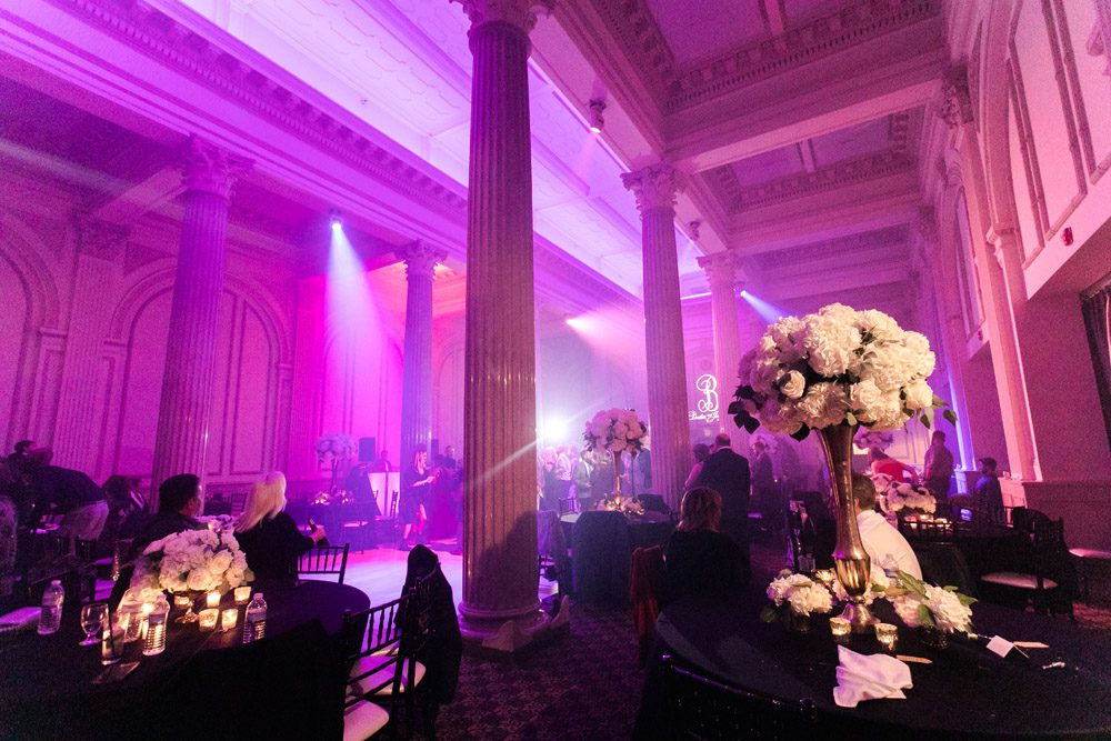 Pink dance lighting with haze at wedding venue