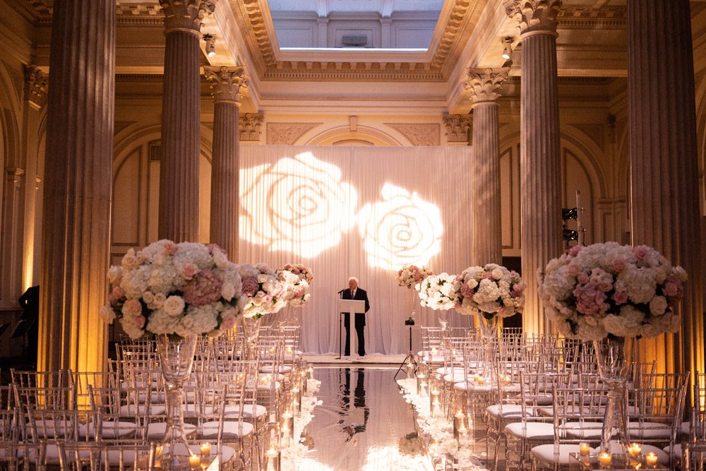 roses projected on backdrop at wedding ceremony