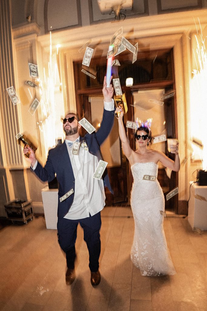 bride and groom with money cannon