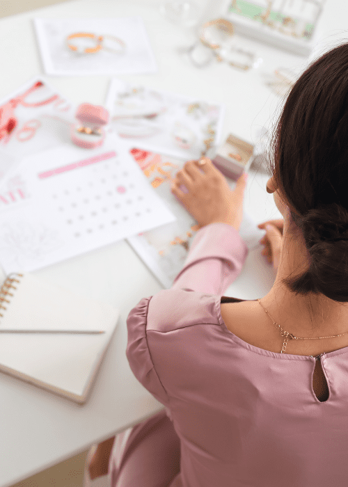 woman looking at wedding planning paperwork