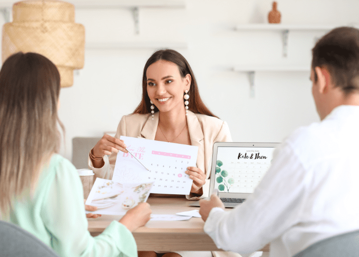 couple meeting with wedding planner