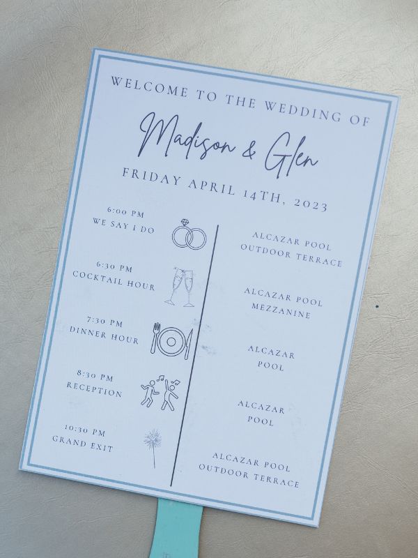 Madison and Glen's wedding program printed onto a fan