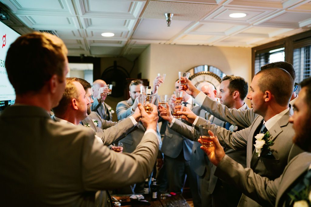 Matt and his groomsmen sharing a toast before the wedding