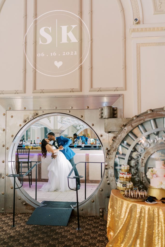 Kevin and Sarah kiss through the door of the Vault Bar