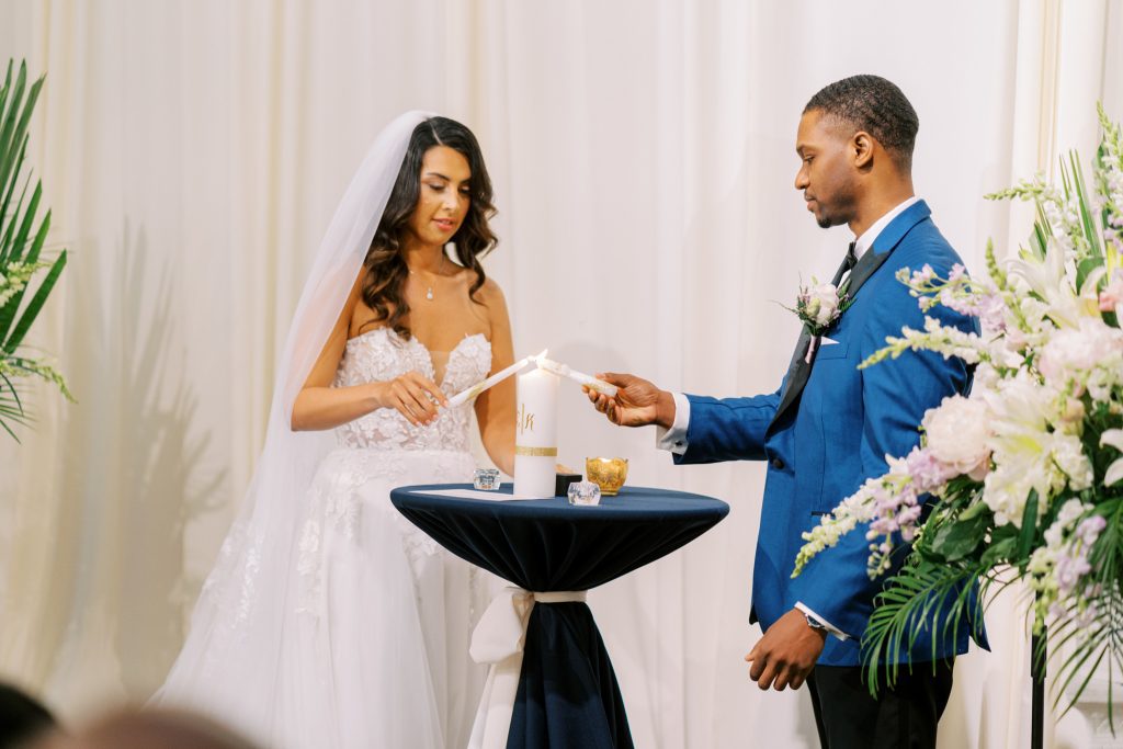 Sarah and Kevin lighting a unity candle