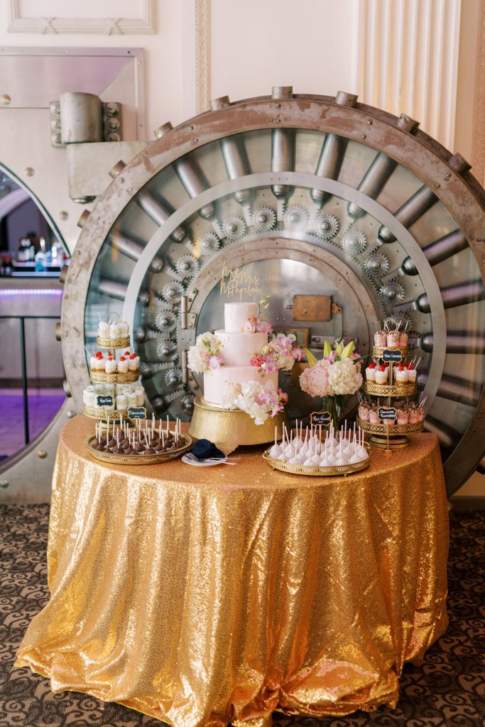 dessert table with Vault door as backdrop