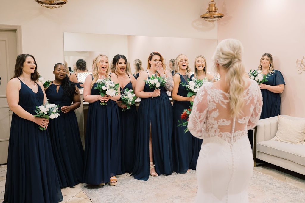 Jess showing her dress to bridesmaids