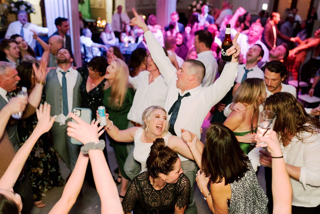 Jess and Matt with their guests on a full dance floor