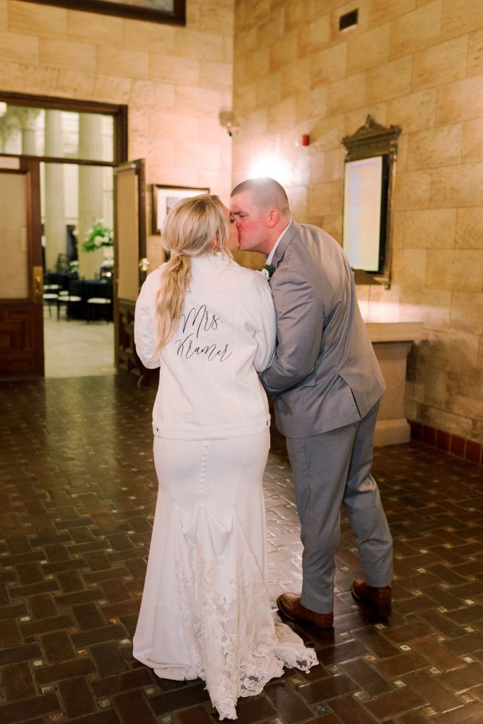 Matt and Jess kiss showing her personalized jacket