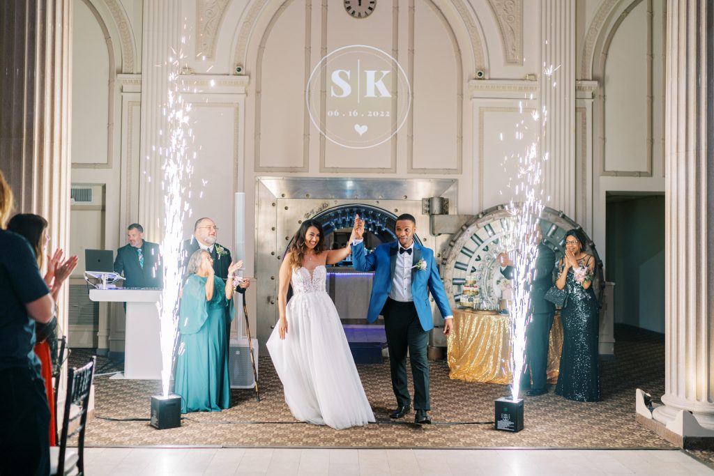 Sarah and Kevin's grand entrance through the Vault Bar with cold spark fountains