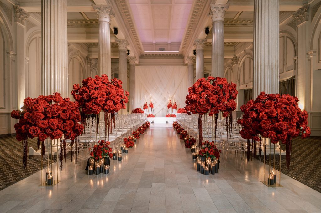 Red floral wedding aisle decor