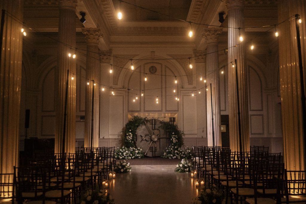 wedding aisle at Treasury on the Plaza softly lit with market lighting