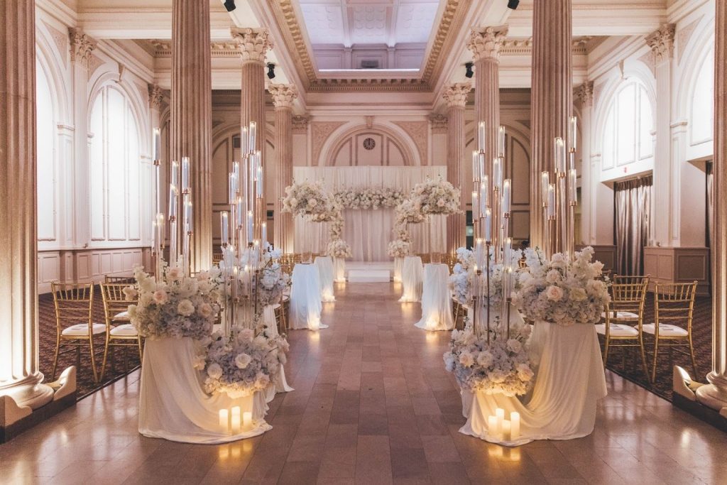 wedding aisle lined with candelabras