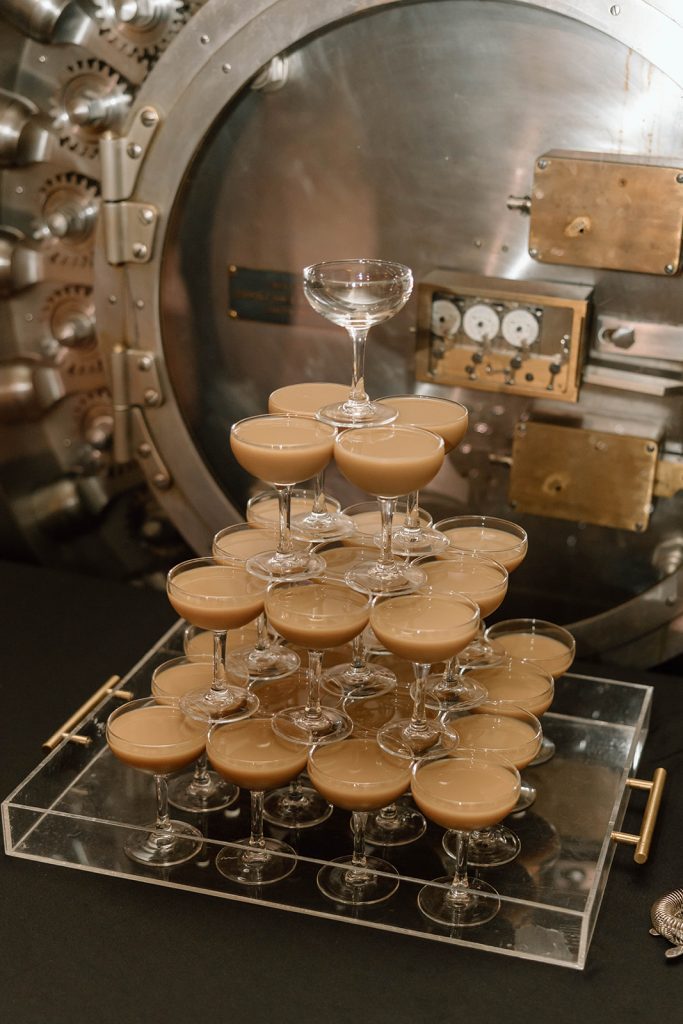 espresso martini tower against the Vault door at Treasury on the Plaza