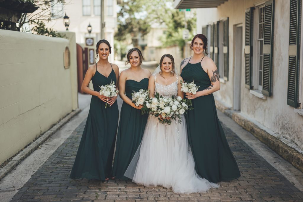 bride and three bridesmaids in quaint St. Augustine street