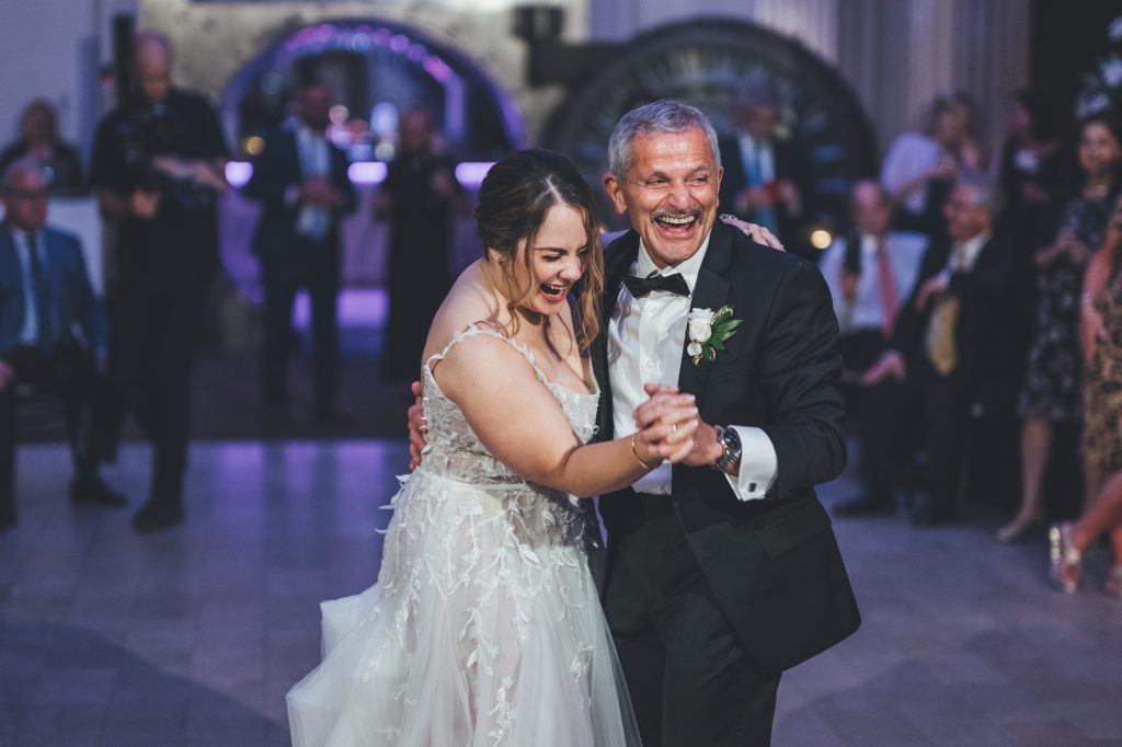 Kathryn dancing with her dad at her wedding reception
