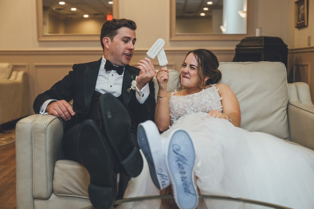 bride and groom "toasting" with popsicles