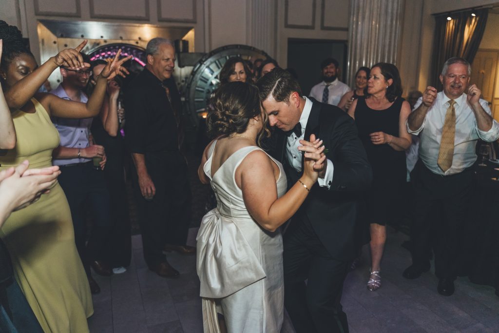 Kathryn and Britt slow dancing with guests at their wedding
