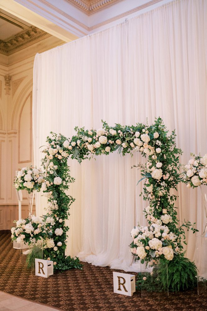 Modern timeless wedding ceremony arch with neutral colors