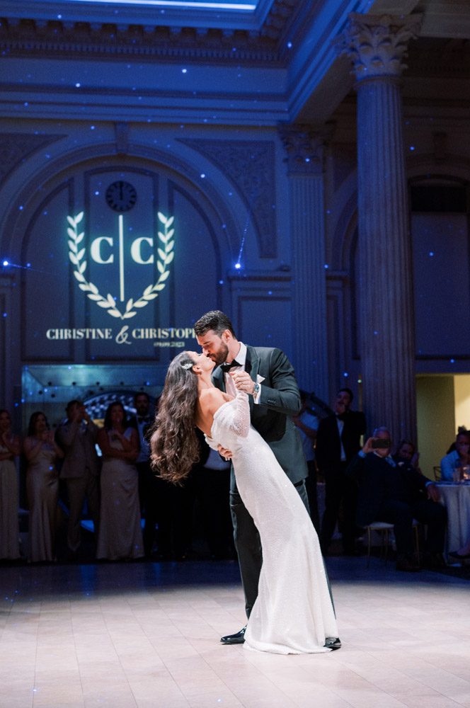 Bride and groom dance during wedding reception at The Treasury on the Plaza