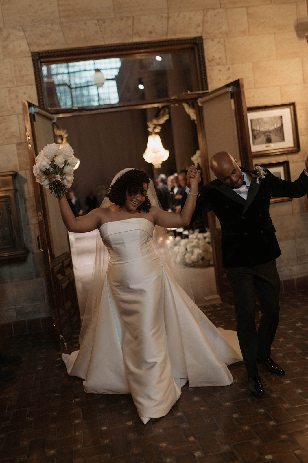 newlyweds celebrating dancing at treasury on the plaza