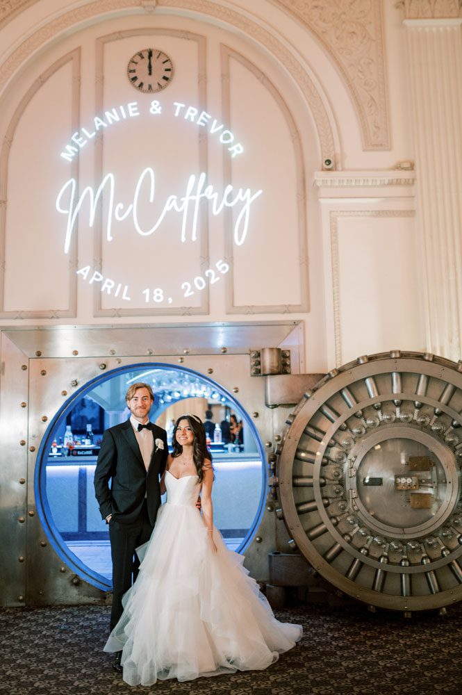 Bride and Groom in front of Vault Bar