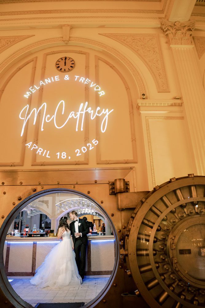 Bride and Groom in front of Vault Bar