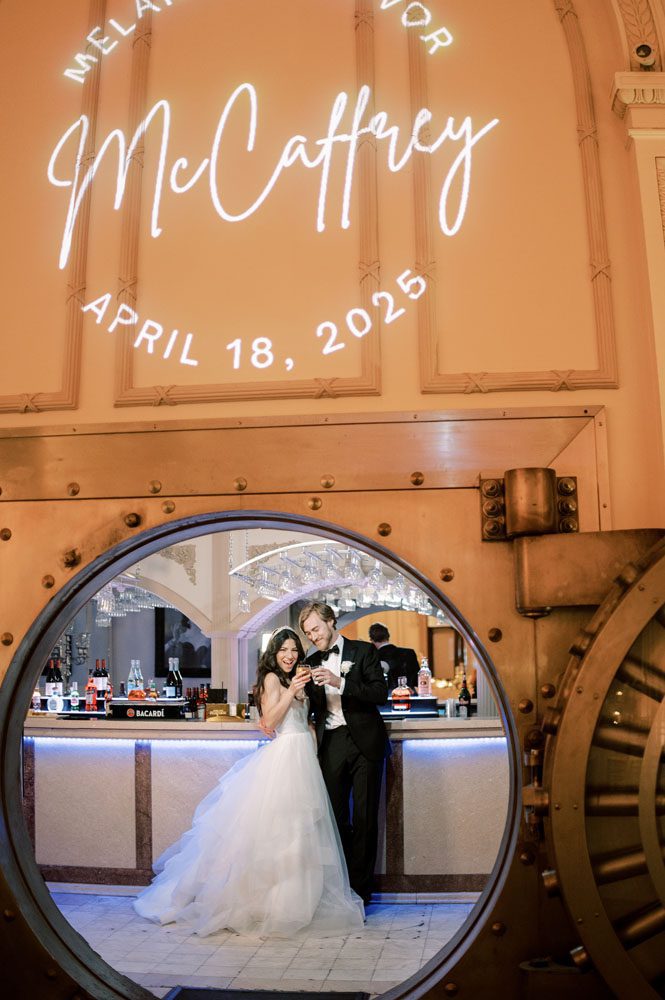 Bride and Groom in front of Vault Bar