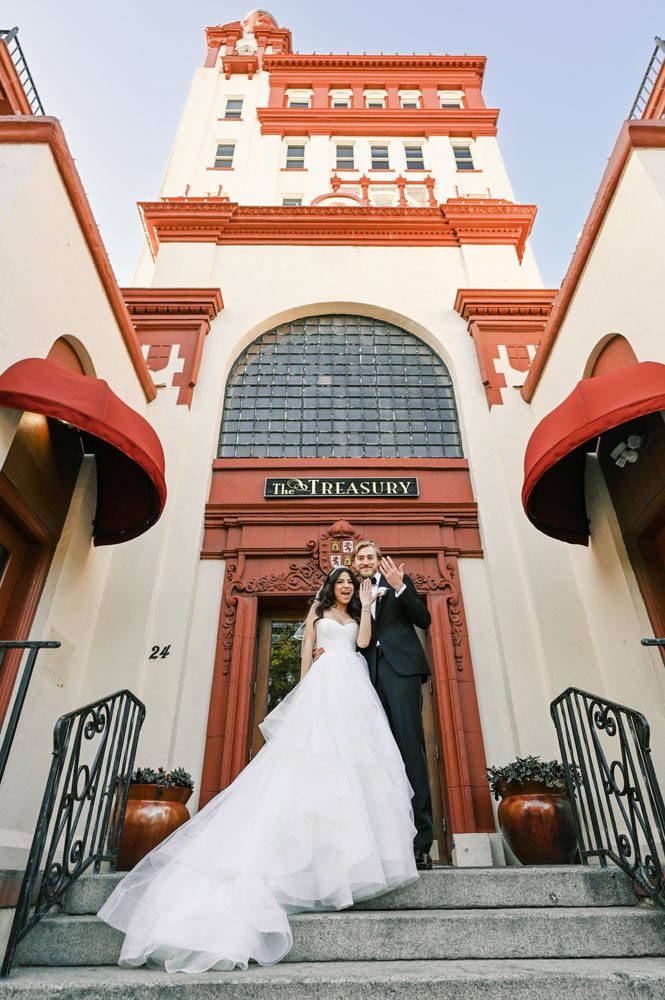 Bride and Groom in front of Building