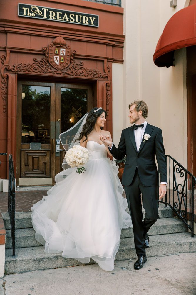 Bride and Groom in front of Building