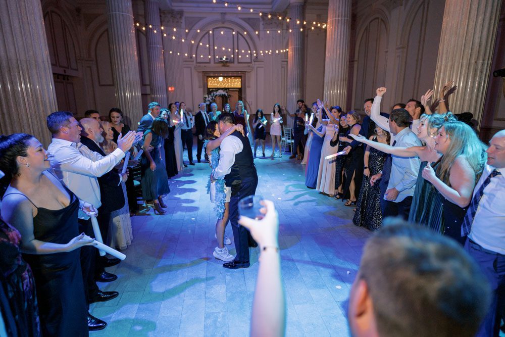 Couple dancing with guests