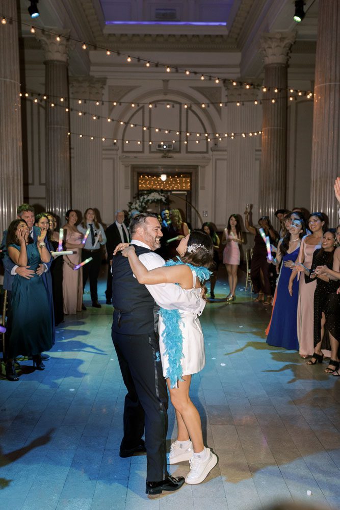 Couple dancing with guests