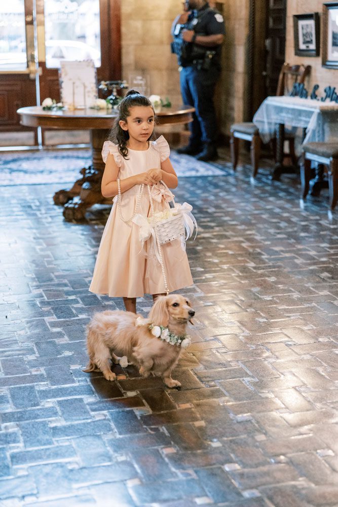 Flower girl walking with dog