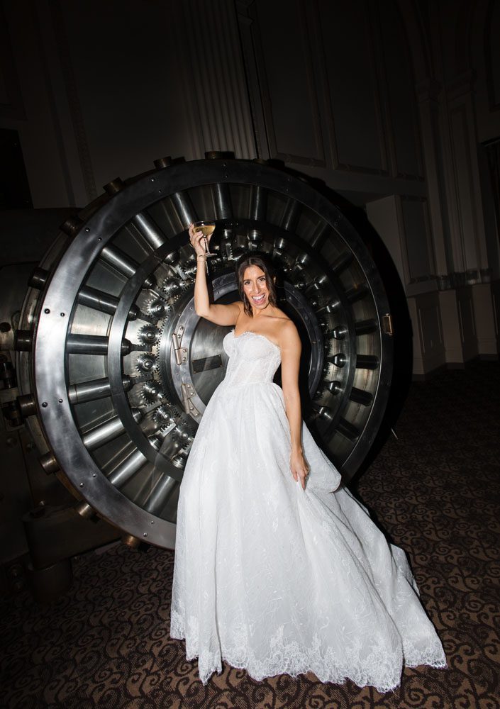 Bride in front of vault