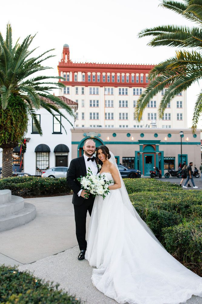 Couple in front of Treasury on the Plaza