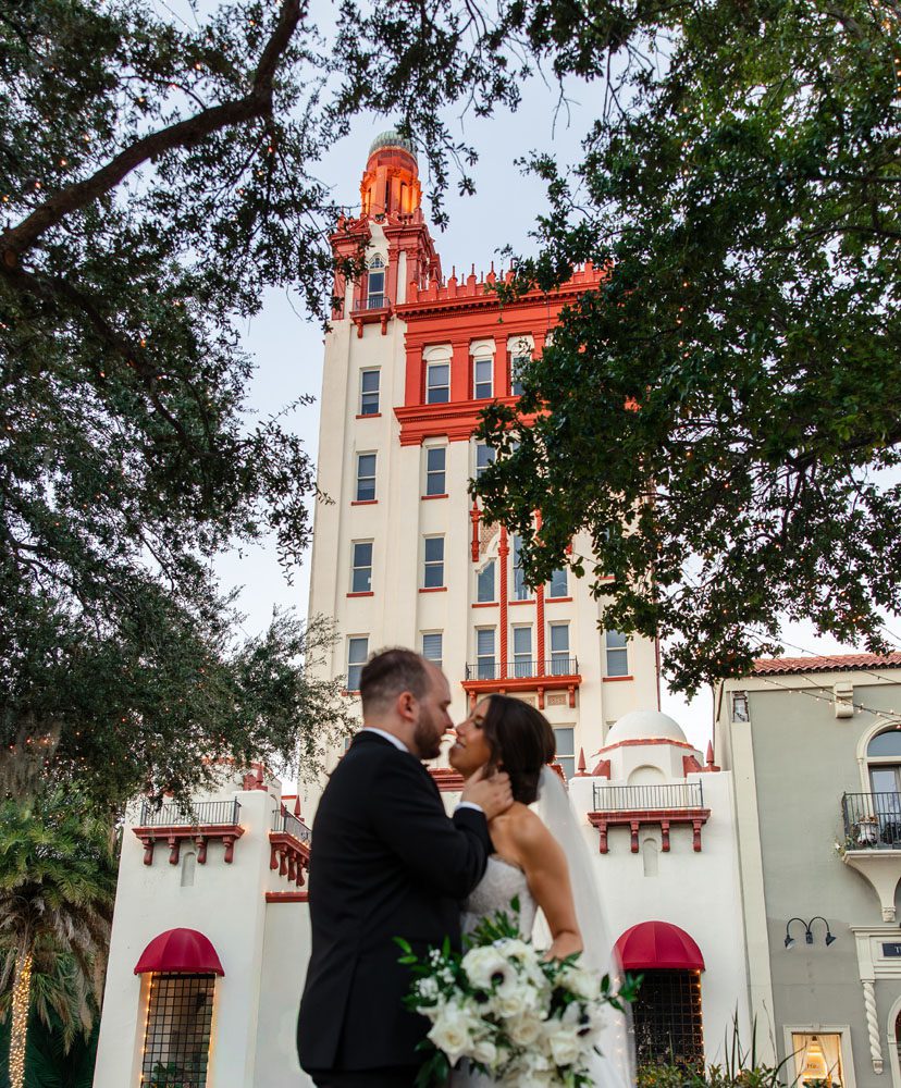 Couple in front of Treasury on the Plaza