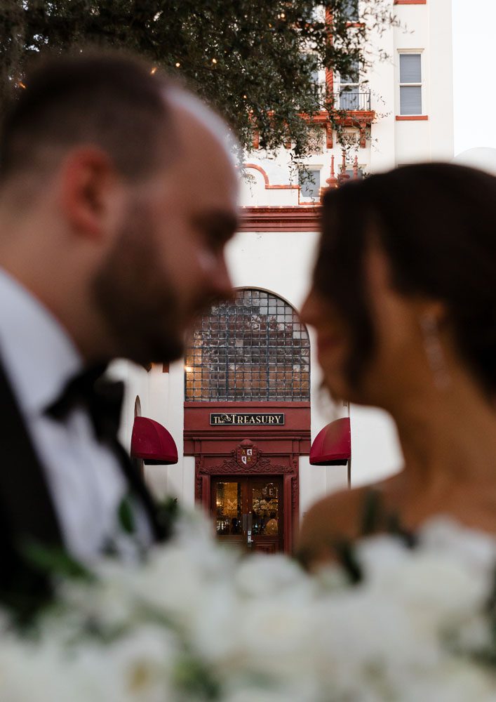 Couple in front of Treasury on the Plaza