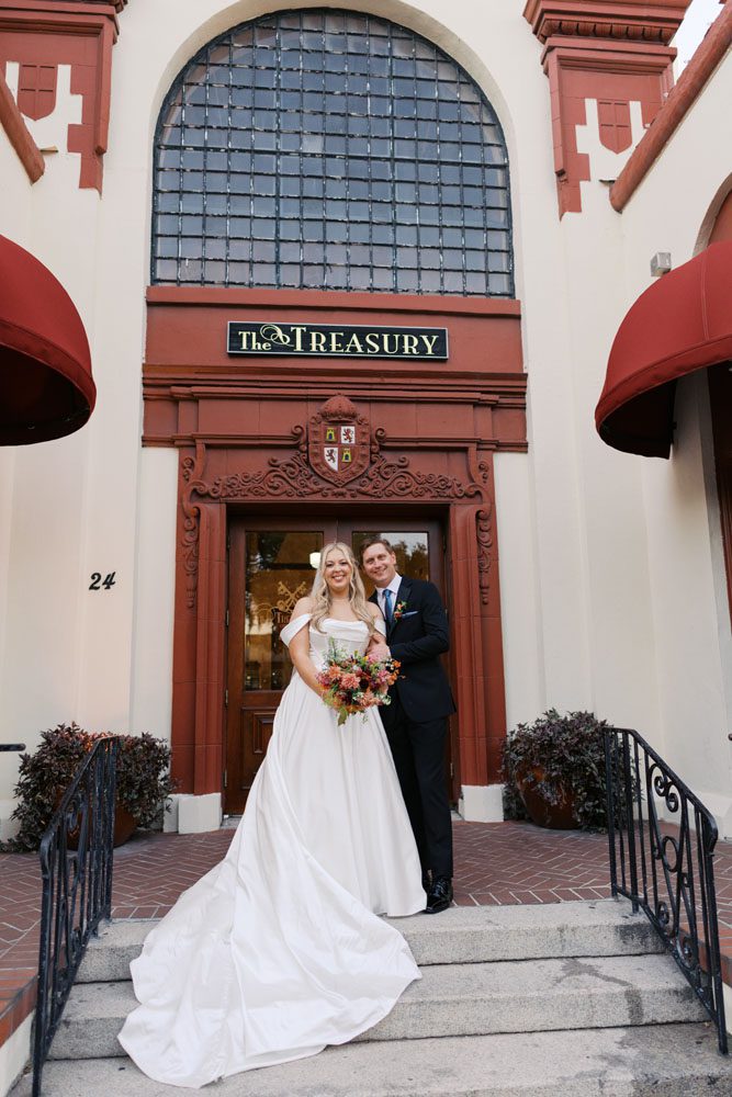 Bride and Groom in front of Treasury on the Plaza