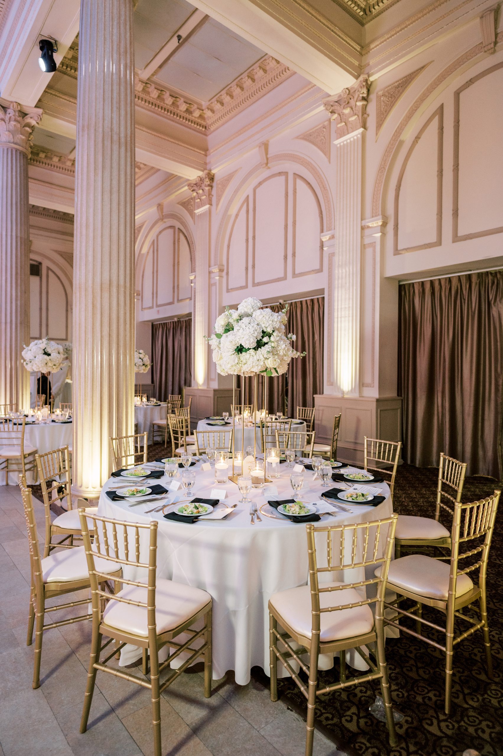 A reception dinner set inside The Treasury's Grand Ballroom for Samantha and Benjamin’s wedding. | Photo: Angelita Esparar